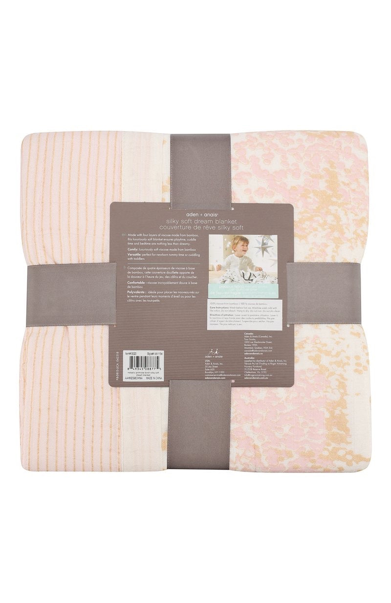 Eclectic Aden + Anais Metallic Primrose dream blanket in four-layer bamboo muslin with soft pink and gold shimmer.