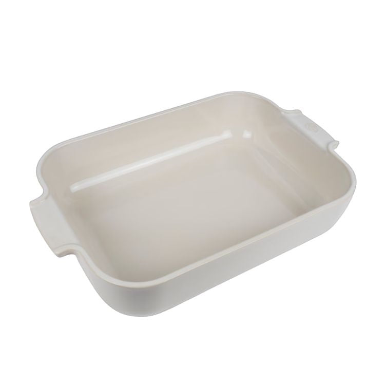 Eclectic Appolia rectangular ceramic oven dish in ecru with wide ribbed handles for easy oven-to-table serving.