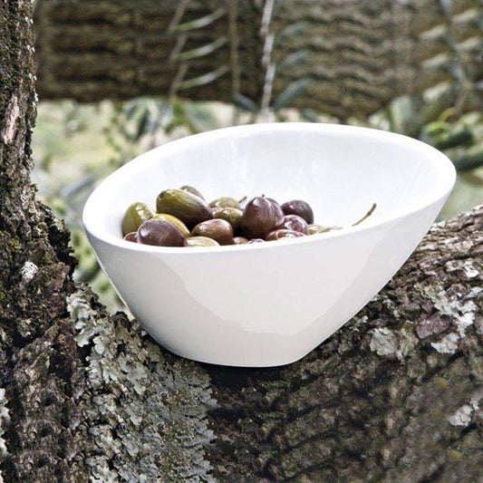 Eclectic ASA Selection ivory white porcelain bowl with a modern asymmetric silhouette filled with olives on a tree