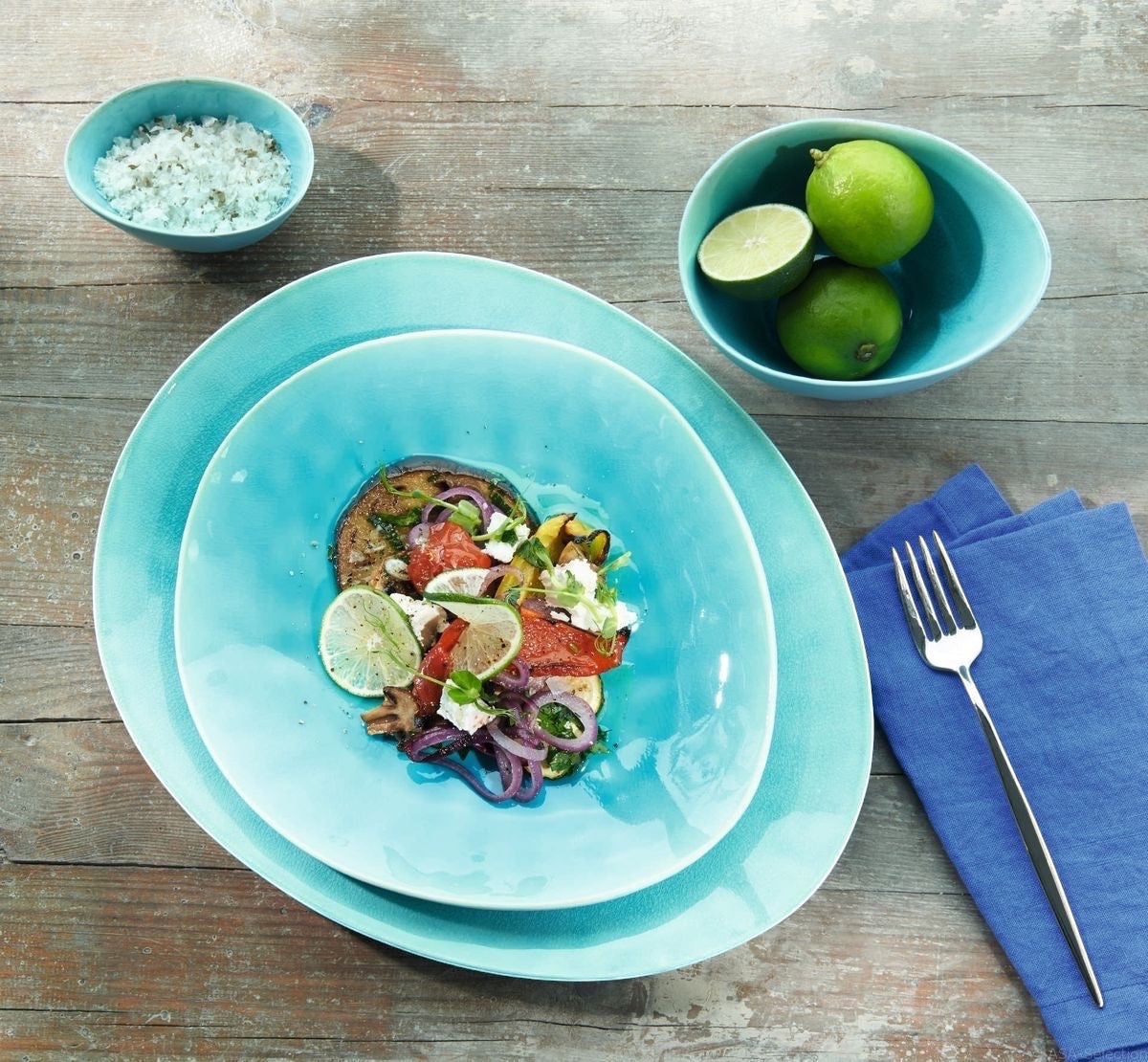Eclectic ASA Selection A La Plage turquoise stoneware bowl set with crackle glaze on a rustic wooden table