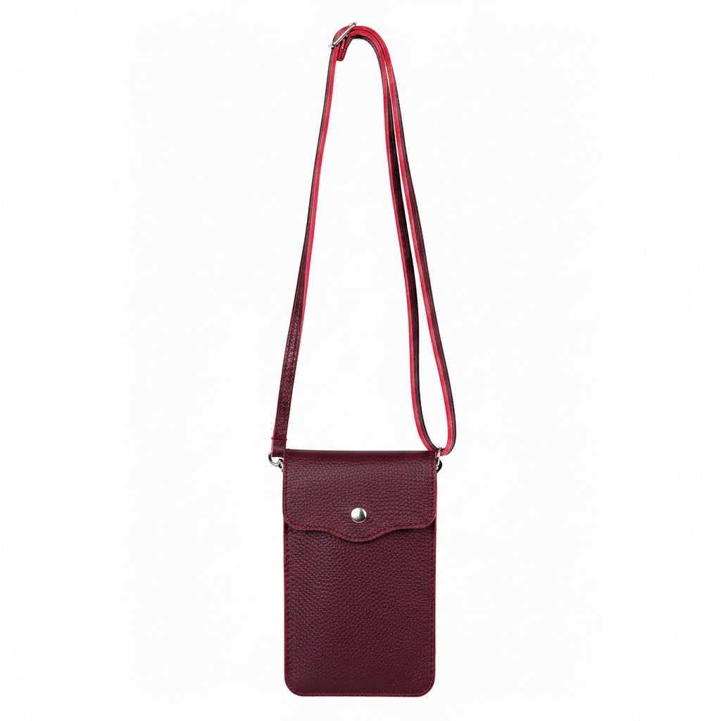 Eclectic burgundy pebbled leather phone crossbody bag with an adjustable strap and silver magnetic closure.