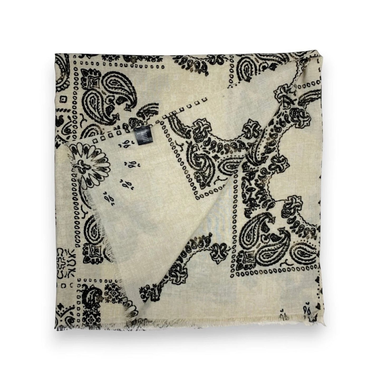 Eclectic cream wool blend scarf featuring a black oversized bandana paisley print with frayed edges