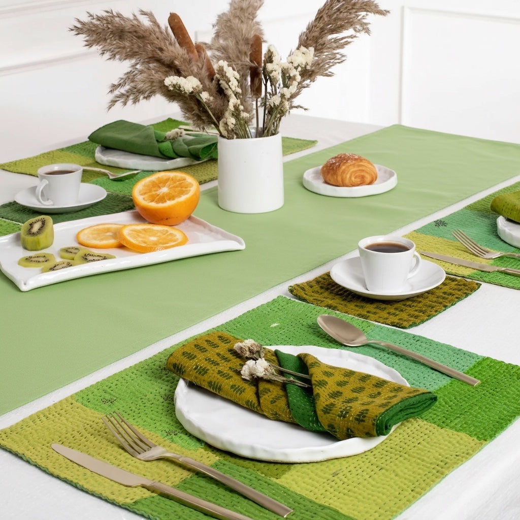 Eclectic Françoise Paviot anise green airlaid table runner roll styled on a dining table with place settings