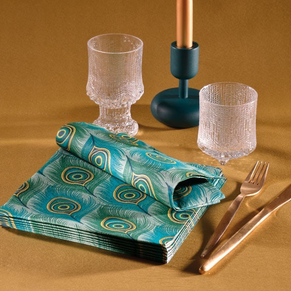 Eclectic Françoise Paviot Paon cocktail napkins with green and gold peacock feather design on a table setting