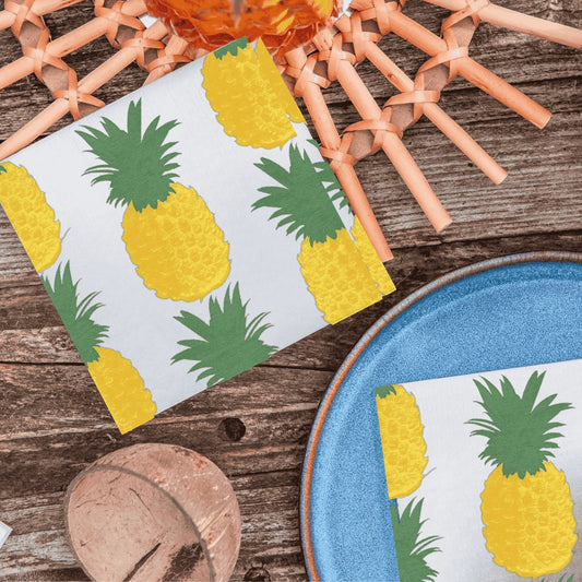 Eclectic Françoise Paviot airlaid dinner napkins with a yellow and green pineapple print on a white background