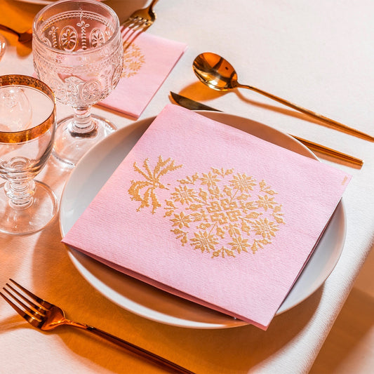 Eclectic Françoise Paviot pink and gold airlaid dinner napkin with embroidered-effect design on a table setting