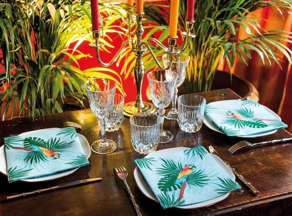 Eclectic Françoise Paviot Perroquet turquoise airlaid dinner napkins with tropical parrot print on a dining table