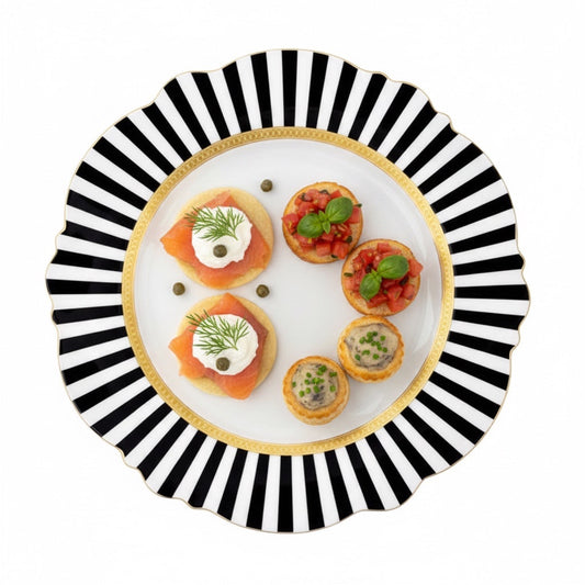 Eclectic Jenna Clifford Botanica Rose fine china server plate with black and white stripes and gold rim holding snacks