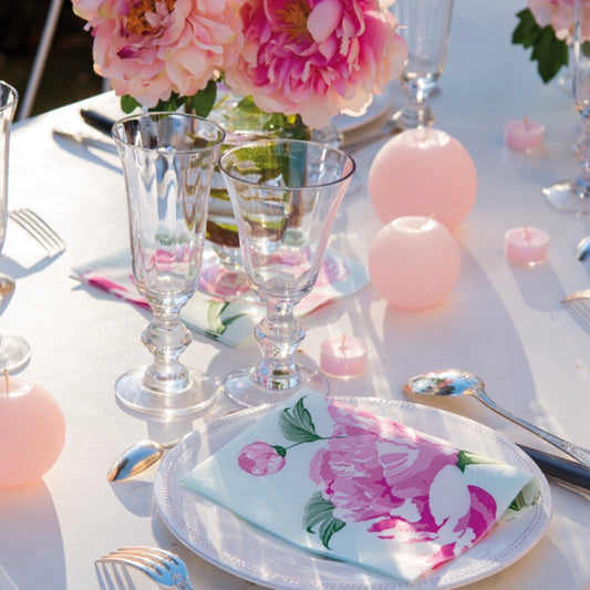 Eclectic Pivoine dinner napkin with pink peony floral print on a white plate at a romantic table setting