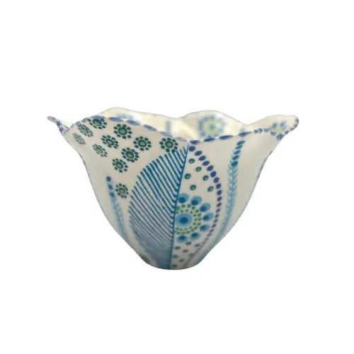 Eclectic Potterseed tulip-shaped ceramic bowl with blue and green floral patterns and curved edges