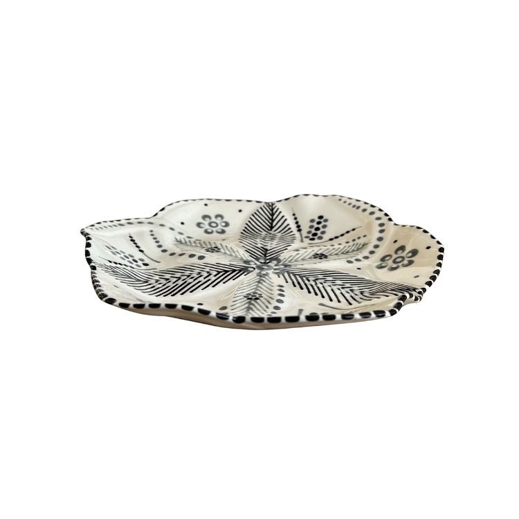 Eclectic Potterseed handcrafted ceramic side plate with a tulip-inspired shape and black botanical floral pattern.