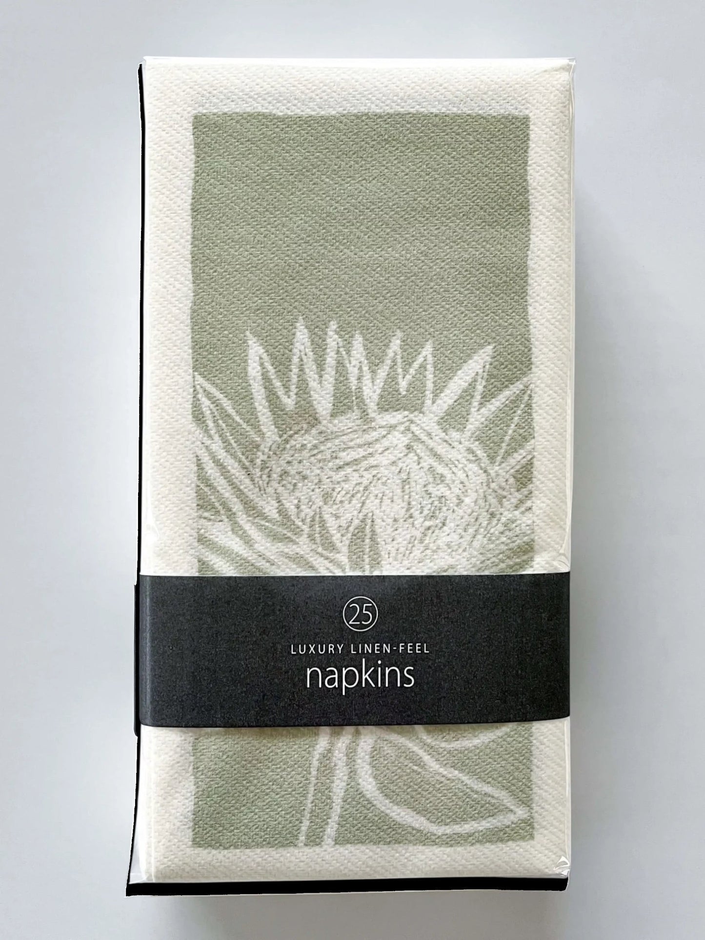 Eclectic pack of 25 green and white botanical protea print airlaid napkins with a premium linen-like texture.