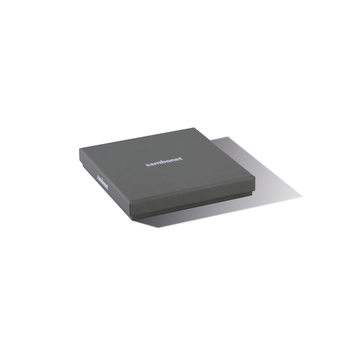 Eclectic Sambonet Party Items spoon set in a grey branded gift box on a white background