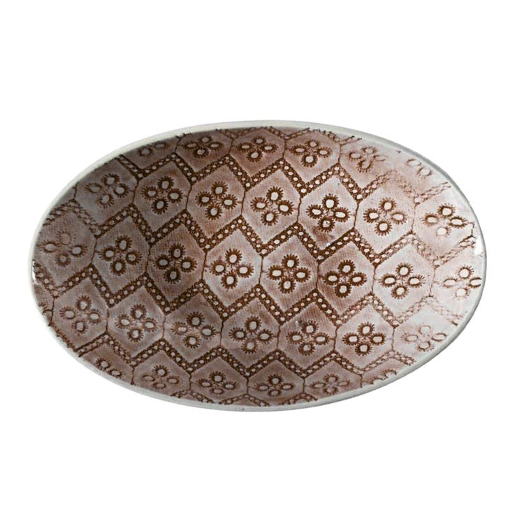 Eclectic Wonki Ware oval stoneware bowl featuring a brown geometric floral pattern on a white background