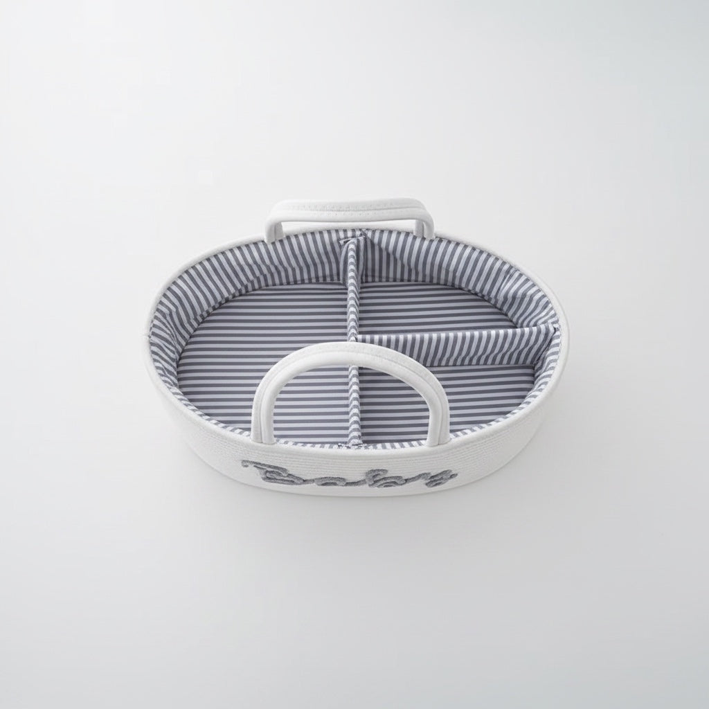 Eclectic white woven cotton rope baby storage basket with grey Baby embroidery and striped interior lining