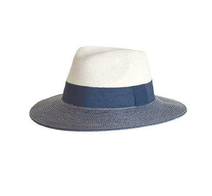 A two-toned Naledi Fedora hat with a white crown and blue brim, featuring a navy ribbon band.