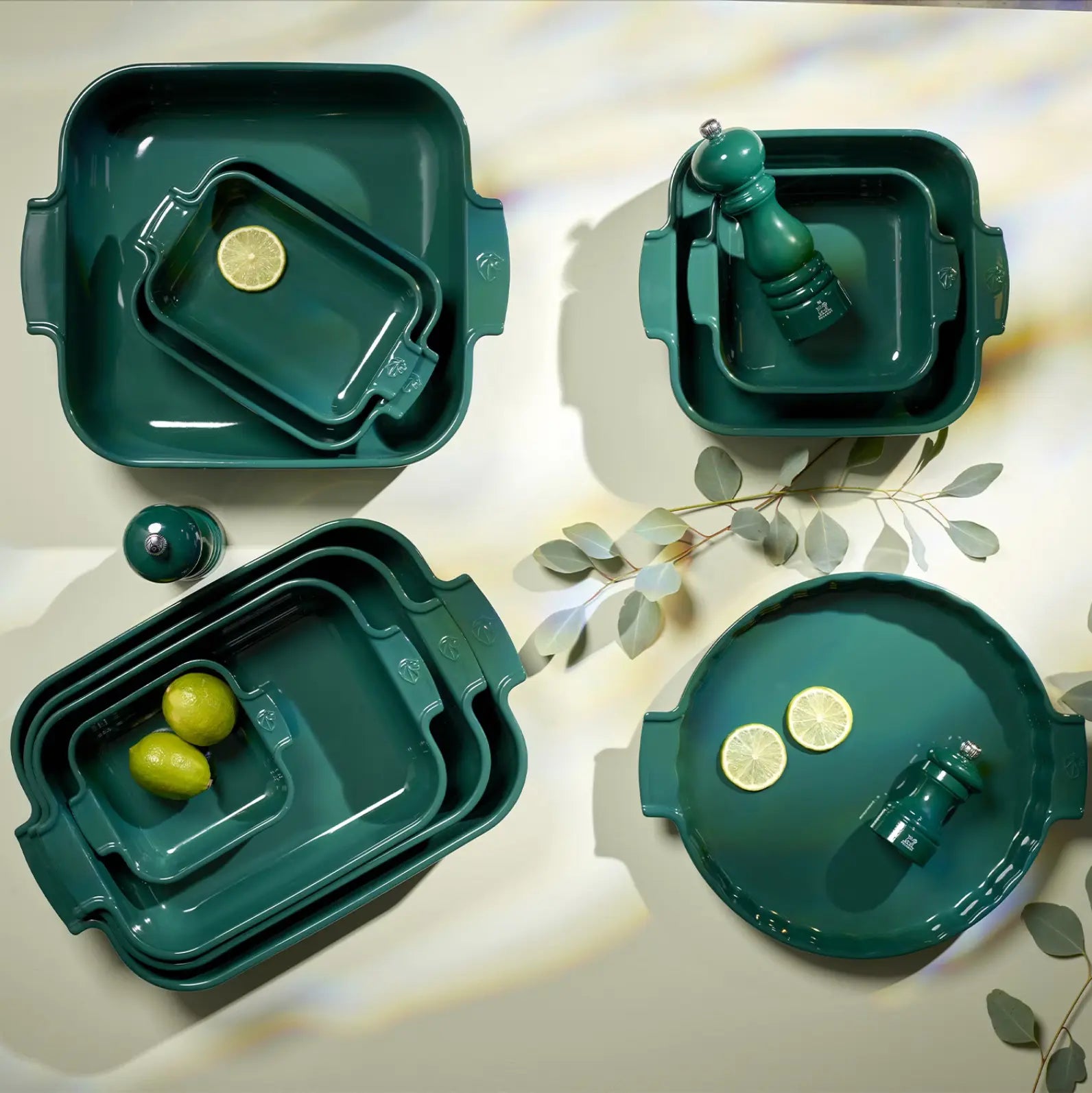 Appolia ceramic bakeware collection with green serving dishes and table accessories.