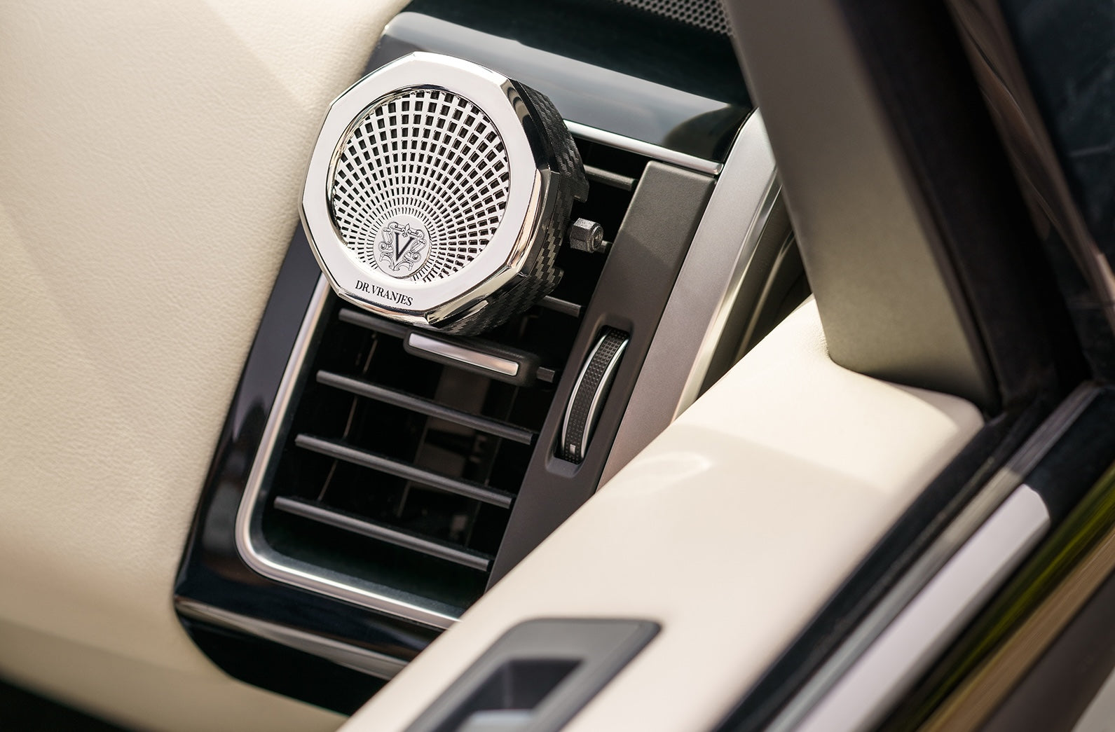 Dr Vranjes car fragrance diffuser on a car air vent for travel scent refills.