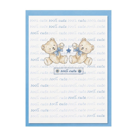 Eclectic 100% Cute baby greeting card featuring two teddy bears with blue bows and rattles on a light blue background.