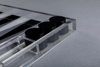 Eclectic modern acrylic backgammon set with black playing pieces in a sleek transparent case