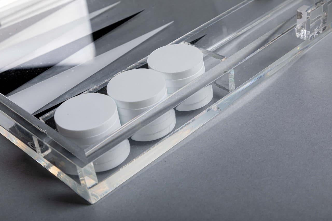 Eclectic modern clear acrylic backgammon set with white playing pieces and black board details
