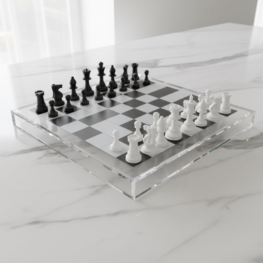 Eclectic 56cm modern acrylic chess board with black and white pieces on a marble surface