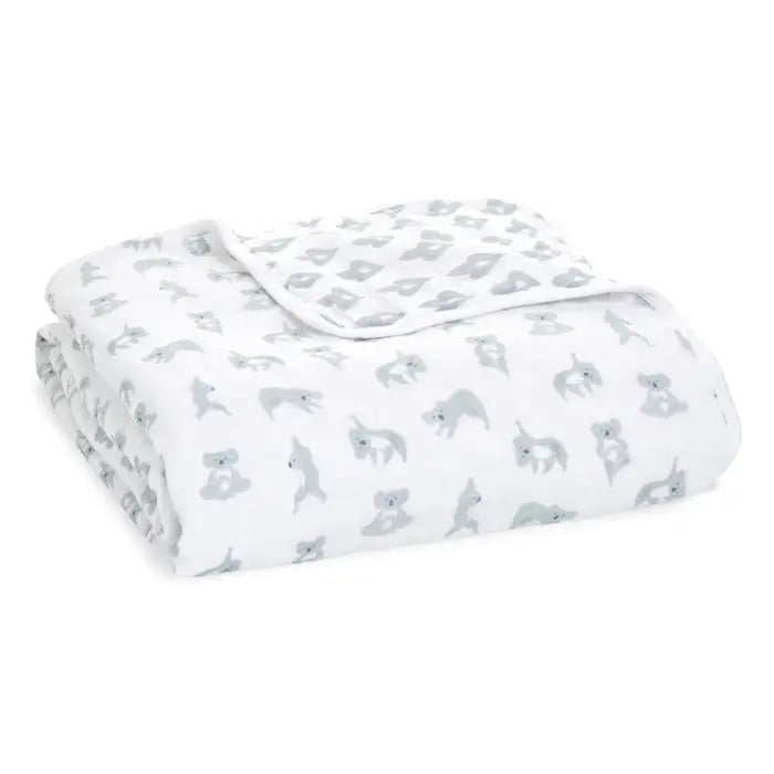 Eclectic Aden + Anais Now + Zen Dream Blanket in white cotton muslin with a grey koala print for babies.