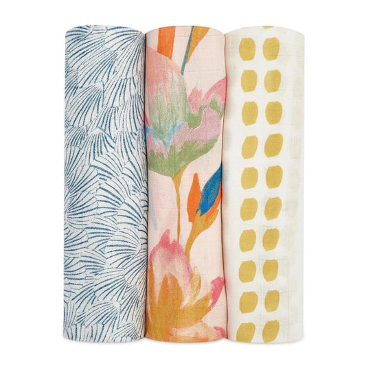 Eclectic aden + anais Marine Garden set of three bamboo muslin swaddles with blue, floral, and yellow dot patterns.