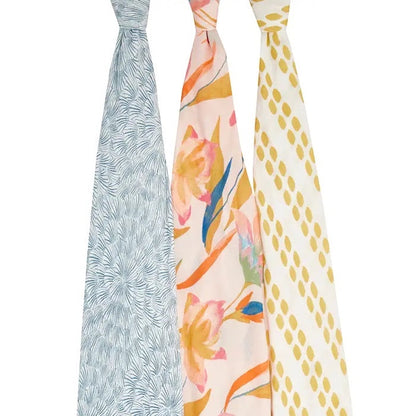 Eclectic aden + anais Marine Garden set of 3 silky soft bamboo muslin swaddles with floral and abstract patterns.