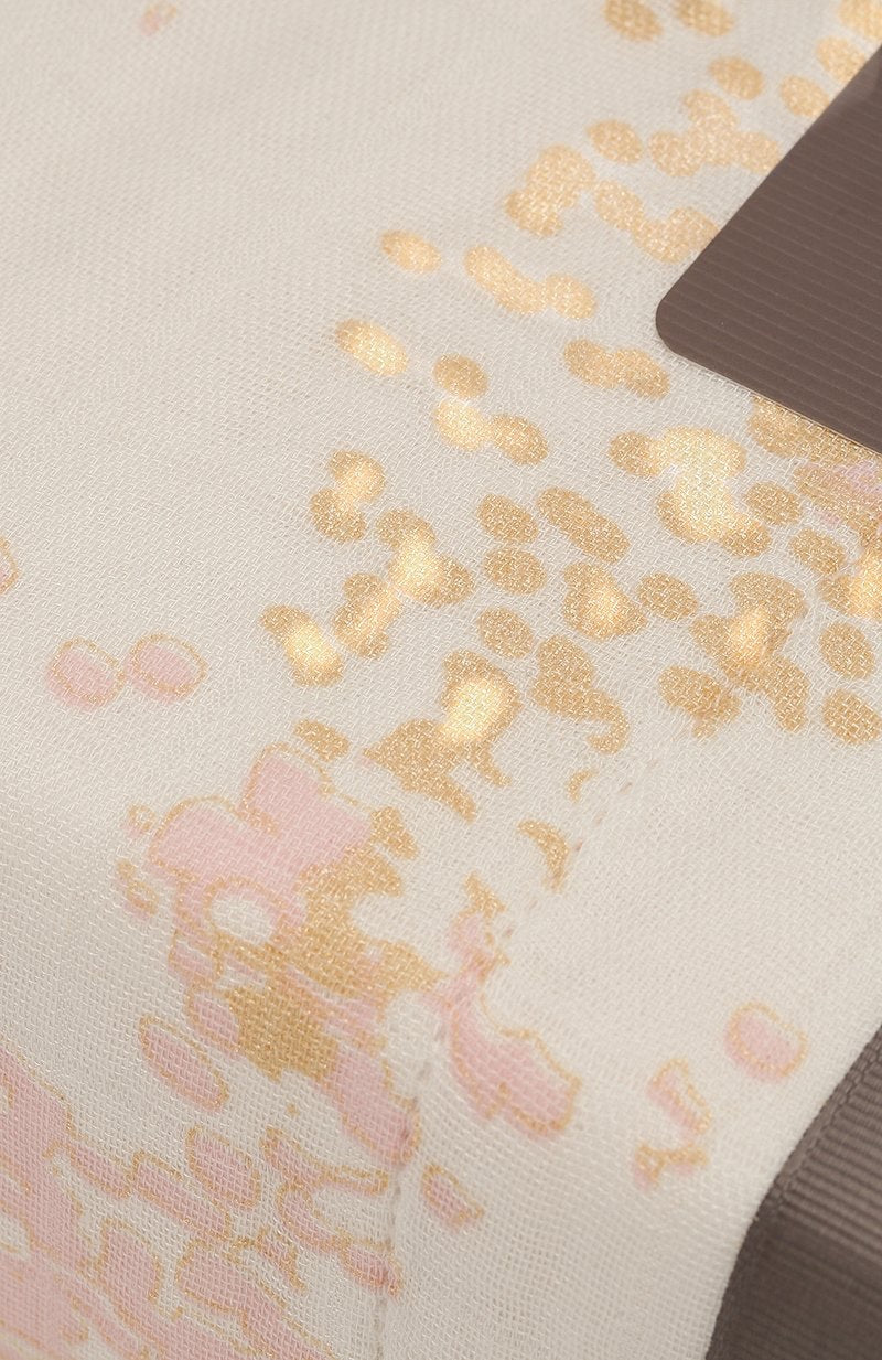 Eclectic Aden + Anais Metallic Primrose dream blanket featuring soft pink and gold floral patterns on bamboo muslin.