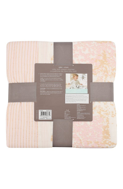 Eclectic Aden + Anais Metallic Primrose dream blanket in four-layer bamboo muslin with soft pink and gold shimmer.