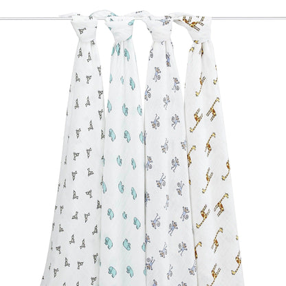 Eclectic Aden + Anais Jungle Jam cotton muslin swaddle blankets with playful animal prints hanging on a rack
