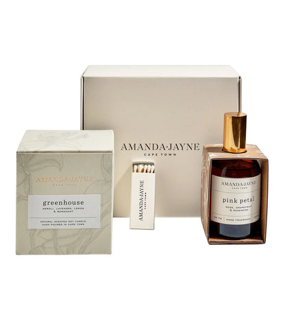 Eclectic Amanda Jayne gift set featuring a scented soy candle, home fragrance spray, and matches in a cream box.