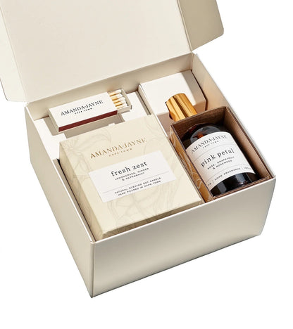 Eclectic Amanda Jayne gift set featuring a scented soy candle, home fragrance spray, and matches in a cream box.