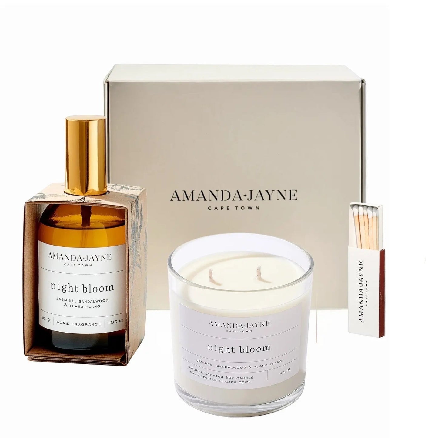 Eclectic Amanda Jayne Night Bloom gift set with soy candle, amber glass room spray, and matches in a cream box.