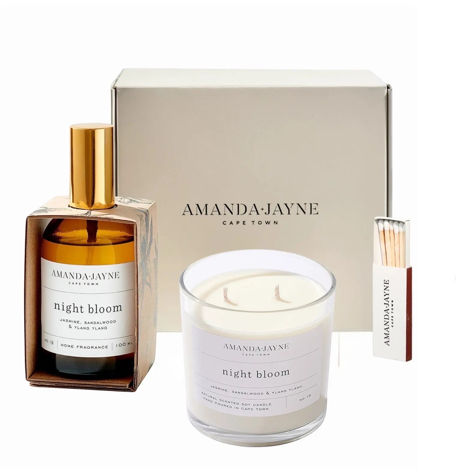Eclectic Amanda Jayne Night Bloom gift set with soy candle, amber glass room spray, and matches in a cream box.
