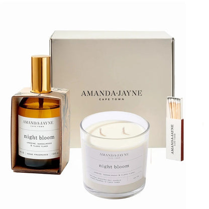 Eclectic Amanda Jayne Night Bloom gift set with soy candle, amber glass room spray, and matches in a cream box.