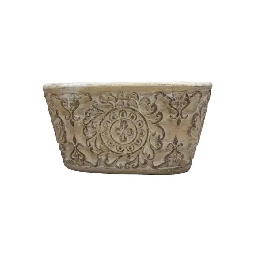 Eclectic antique oval cement herb planter with distressed patina finish and intricate European scrollwork detailing.