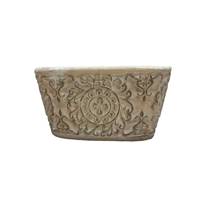 Eclectic antique oval cement herb planter with distressed patina finish and intricate European scrollwork detailing.