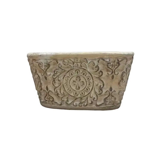 Eclectic antique oval cement herb planter with distressed patina finish and intricate European scrollwork detailing.