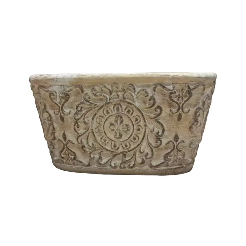 Eclectic antique oval cement herb planter with distressed patina finish and intricate European scrollwork detailing.