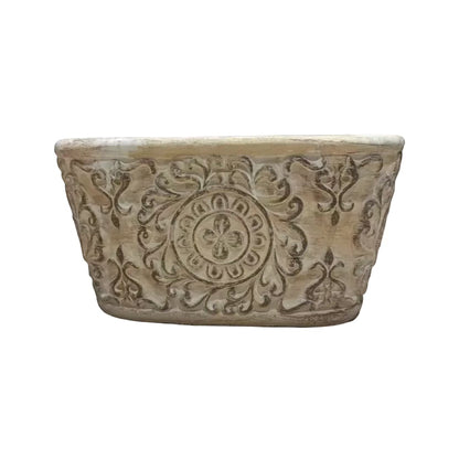 Eclectic antique oval cement herb planter with distressed patina finish and intricate European scrollwork detailing.