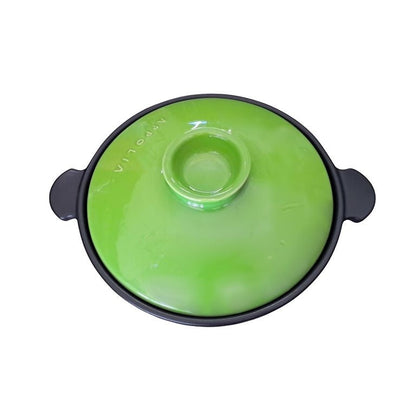 Eclectic Appolia Terre & Flamme round ceramic casserole pot with a vibrant kiwi green lid and black base.