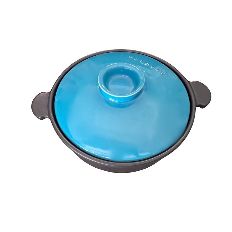 Eclectic Appolia Terre & Flamme round ceramic casserole pot in black with a vibrant Curaçao blue lid and side handles.