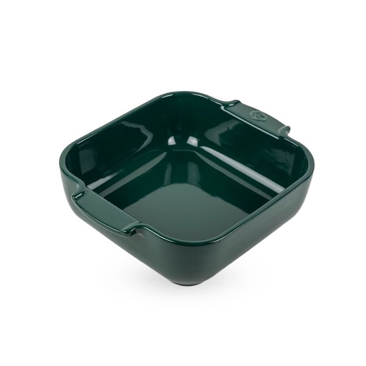 Eclectic Appolia square ceramic oven dish in a glossy forest green glaze with wide ribbed handles.
