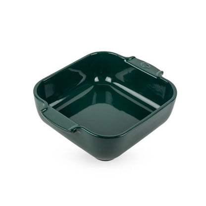 Eclectic Appolia square ceramic oven dish in a glossy forest green glaze with wide ribbed handles.
