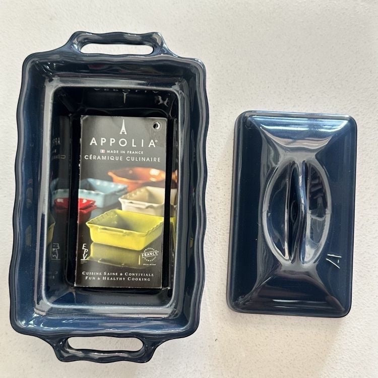 Eclectic Appolia navy ceramic terrine dish with lid, featuring a durable glazed finish for baking or serving butter.