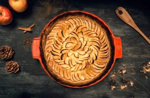 Eclectic Appolia 33 cm ceramic pie dish in rich red filled with a baked apple tart on a dark rustic table