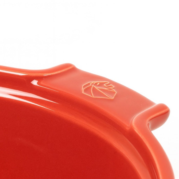 Eclectic Appolia 24cm ceramic soufflé dish in rich red with ergonomic handles and embossed logo detail