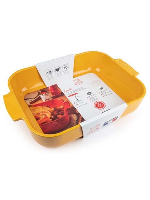 Eclectic Appolia rectangular ceramic oven dish in saffron yellow with wide ribbed handles and product information label.